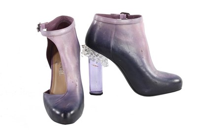 Lot 211 - Two pairs of Chanel shoes in shades of purple...