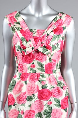 Lot 61 - A figure-hugging rose printed silk dress, late...