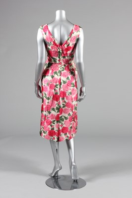 Lot 61 - A figure-hugging rose printed silk dress, late...