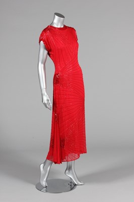 Lot 91 - An Oleg Cassini red bugle beaded evening gown...