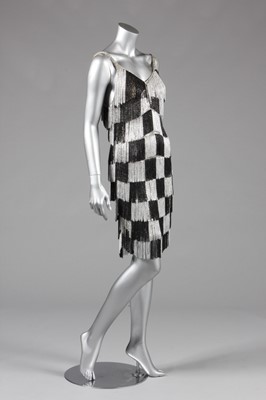 Lot 106 - A Loris Azzaro silver and black chequered,...