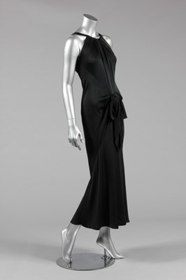 Lot 115 - An Yves Saint Laurent couture black satin bias...