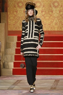 Lot 40 - A Chanel striped tweed suit, Pre-Fall 2009,...