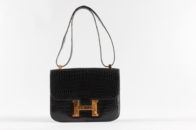 Lot 13 - An Hermès Constance black crocodile handbag,...