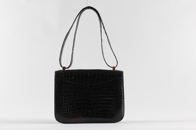 Lot 13 - An Hermès Constance black crocodile handbag,...