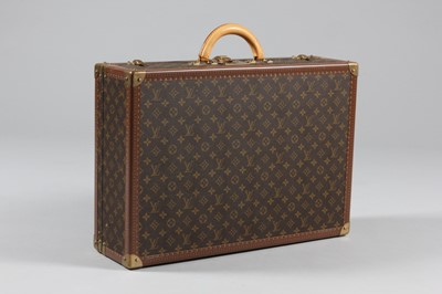 Lot 19 - A Louis Vuitton hard-sided suitcase, with...