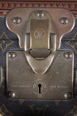 Lot 19 - A Louis Vuitton hard-sided suitcase, with...