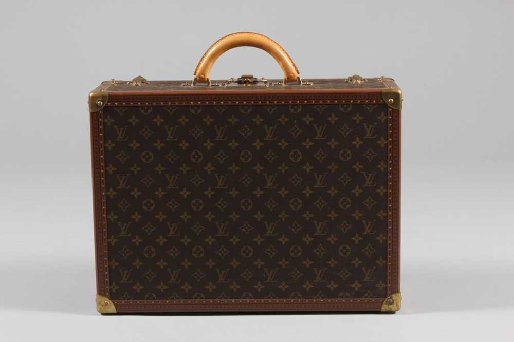 Lot 11 - A Louis Vuitton hard-sided suitcase, with...