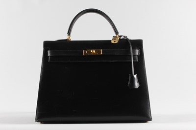 Lot 21 - An Hermès black box calf leather Kelly bag,...