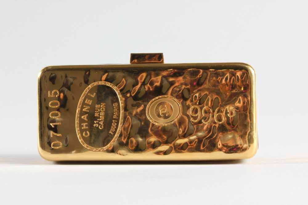 Lot 6 - A Chanel gilt metal gold bullion minaudiere,...