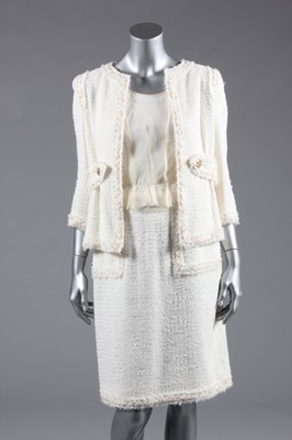 Lot 166 - A Chanel cream tweed suit, labelled 'Chanel'...