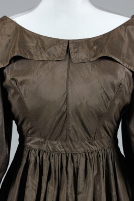 Lot 43 - A brown taffeta dress, circa 1835, with gigot...