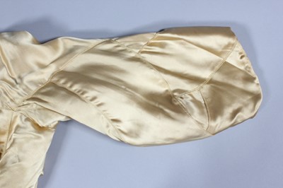 Lot 64 - A fine and important Chanel couture gold satin...
