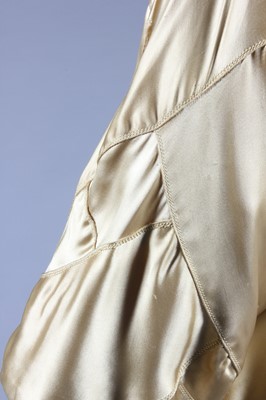 Lot 64 - A fine and important Chanel couture gold satin...
