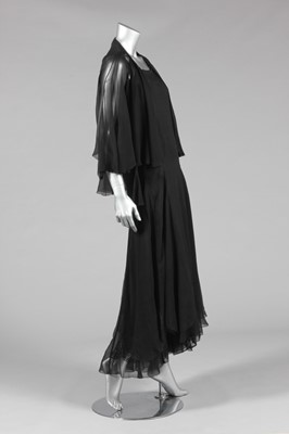 Lot 61 - A Chanel couture black chiffon evening jacket...