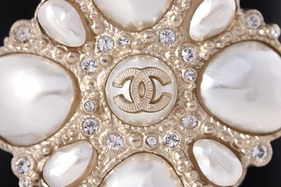 Lot 11 - A Chanel black resin cuff bracelet, 'Coco Rock'...