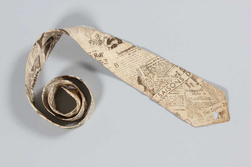 Lot 77 - A Schiaparelli newspaper-print silk tie for...