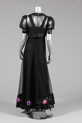 Lot 86 - A black lace and cir (wet look) rayon evening...