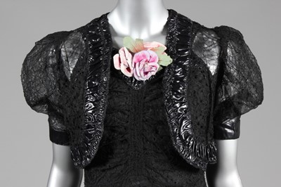 Lot 86 - A black lace and cir (wet look) rayon evening...