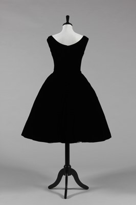 Lot 87 - A black velvet cocktail dress, attributed to...
