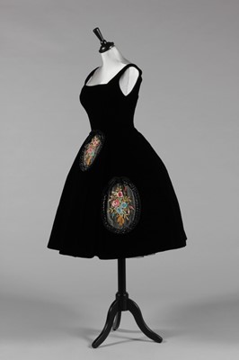 Lot 87 - A black velvet cocktail dress, attributed to...