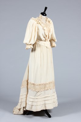 Lot 61 - An ivory silk bridal gown, 1906, comprising:...