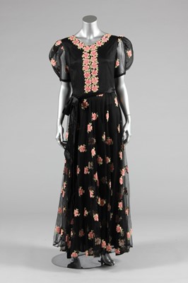 Lot 64 - An embroidered black tulle evening gown, mid...