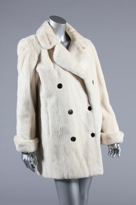 Lot 99 - An Yves Saint Laurent fourrures ivory...