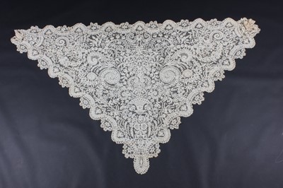 Lot 513 - A fine tapelace shawl circa 1860, with...