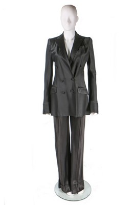 Lot 274 - A John Galliano satin trouser suit, 'Black'...