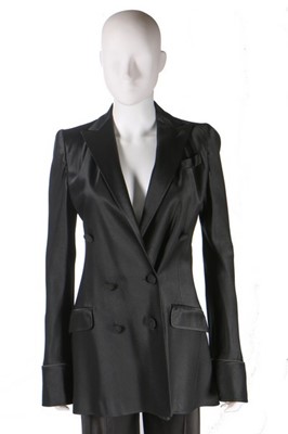 Lot 274 - A John Galliano satin trouser suit, 'Black'...