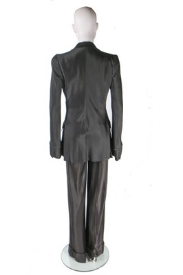 Lot 274 - A John Galliano satin trouser suit, 'Black'...