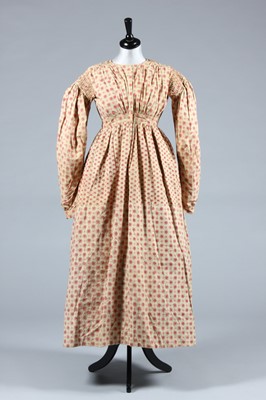 Lot 151 - A printed cotton day dress, late 1830s, the...