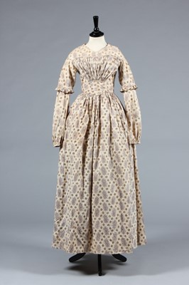 Lot 154 - A printed cotton day dress circa 1839, roller...