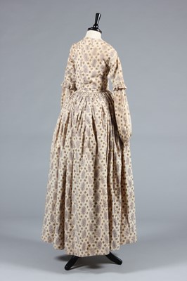 Lot 154 - A printed cotton day dress circa 1839, roller...