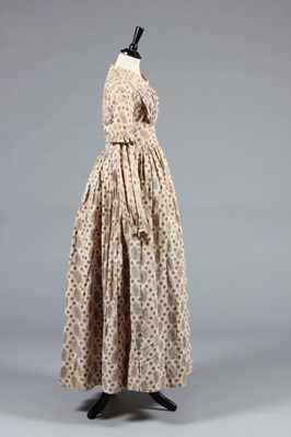 Lot 154 - A printed cotton day dress circa 1839, roller...