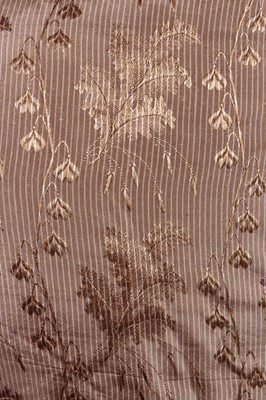 Lot 155 - A brown silk damask gown, circa 1830, with...