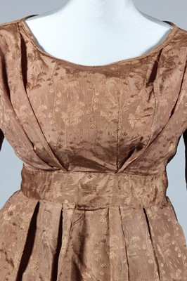 Lot 155 - A brown silk damask gown, circa 1830, with...