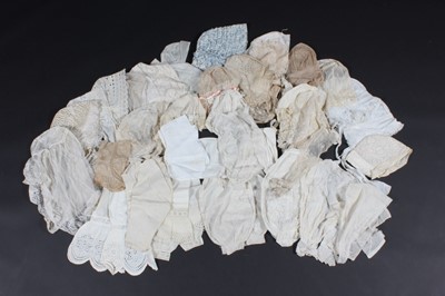 Lot 518 - A group of caps and bonnets, 19th century,...