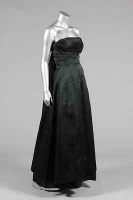 Lot 161 - A Givenchy black organza evening gown, circa...