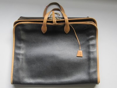 Lot 204 - An Hermès black leather suit/dress carrier,...