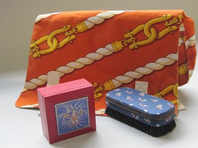 Lot 205 - An Hermès printed cotton toiletry bag, 1980s,...