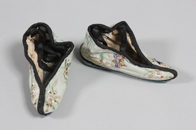 Lot 214 - A pair of embroidered blue damask silk shoes...