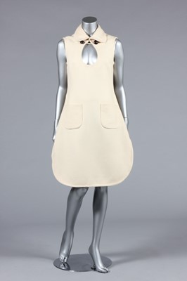 Lot 228 - A Pierre Cardin cream wool tabard-dress, early...