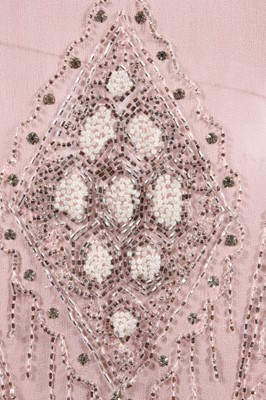 Lot 245 - A pale pink beaded flapper dress, late 1920s,...