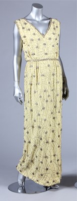 Lot 319 - A Malcolm Starr beaded primrose crepe evening...