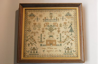 Lot 539 - A rare embroidered sampler worked by a boy -...