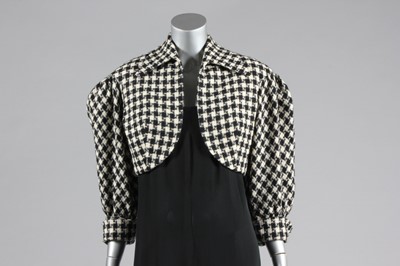 Lot 330 - A Norman Norell flecked grey tweed day-suit,...