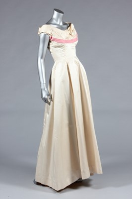 Lot 336 - A Ceil Chapman ivory satin ball gown, circa...