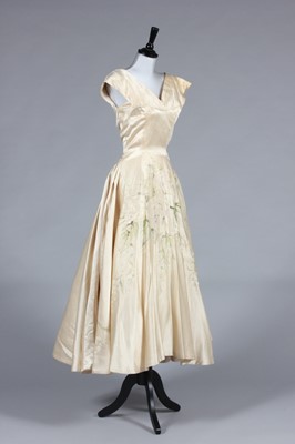 Lot 337 - An Ernest Newman champagne silk and lace...